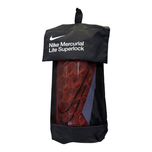 Espinillera Nike